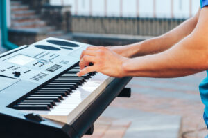 the guy plays the electronic piano