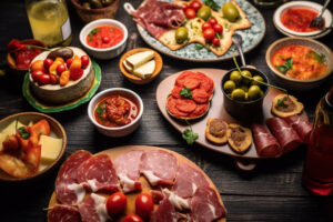 spanish tapas and sangria on wooden table. typical spanish tapas concept.